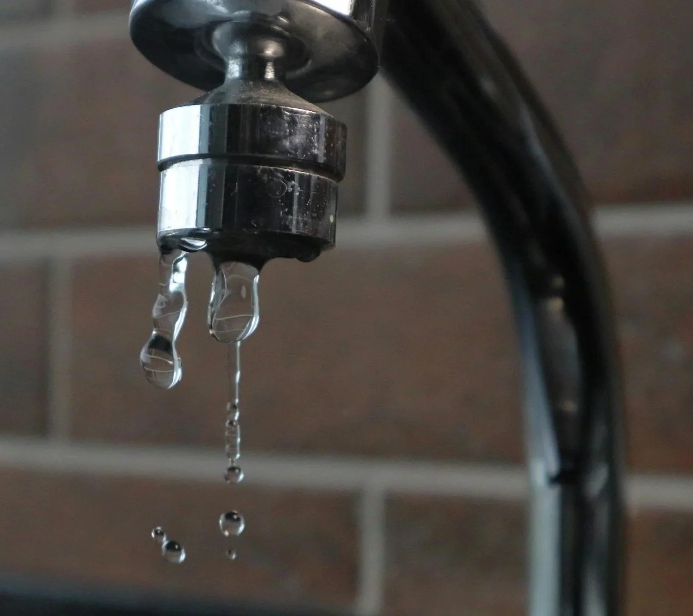 A faucet with water dripping