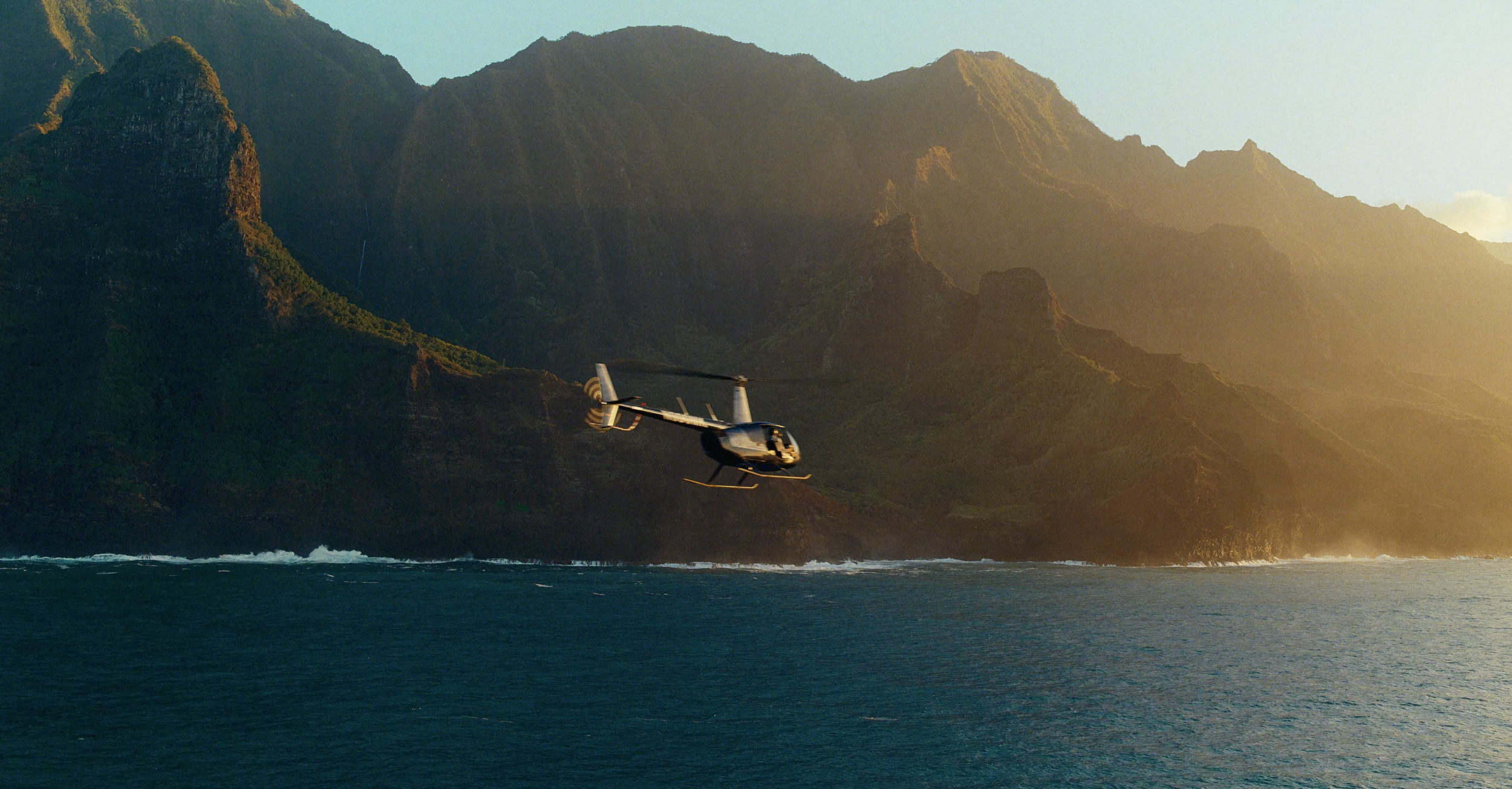 Authentic lifestyle photography of a couple on a private yacht charter off the coast of Maui.
