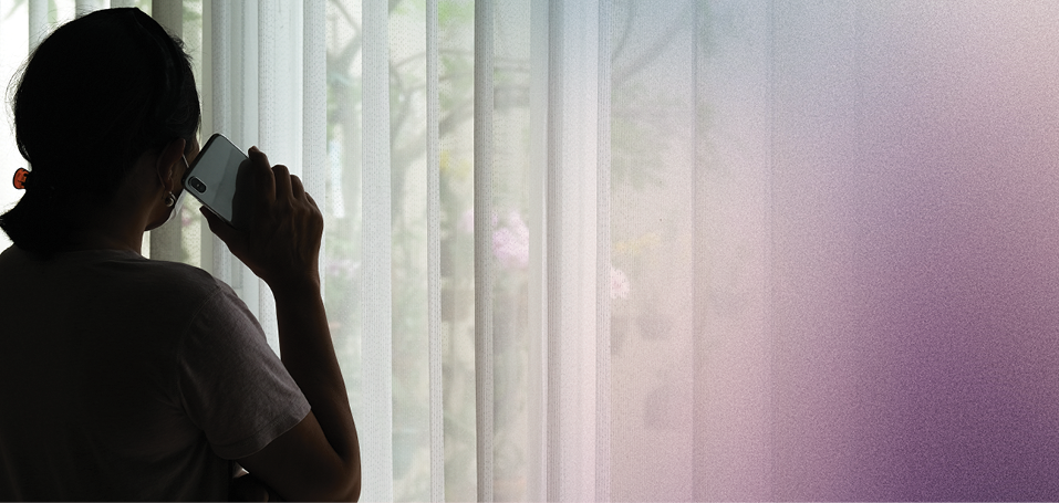 Woman in silhouette talking on the phone.