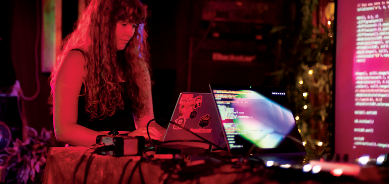 Sara Adkins performs live, combining playing instruments with coding. 