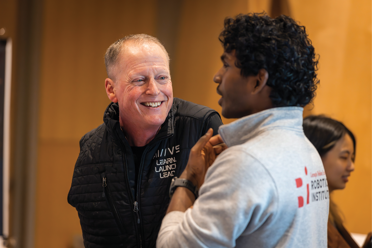 Dave Mawhinney shares a moment of advice with an early career founder.