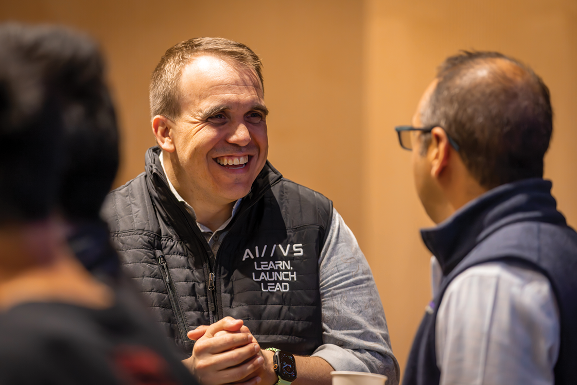 AI//VS architect and senior instructor Adam Paulisick, left, speaks with fellow instructor Sean Ammirati.