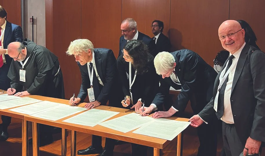 Alex Waibel (right), professor in LTI, pictured signing documents with other members of the Vatican Working Group on September 12, 2025.