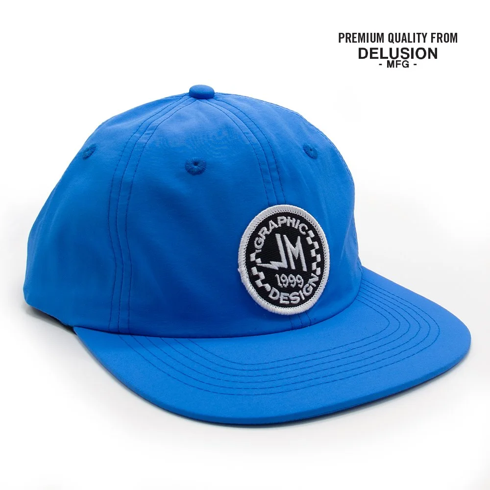 JM_Badge_Delusional_Nylon_Blue_3QTER_jimmy_mnoian_design.jpg