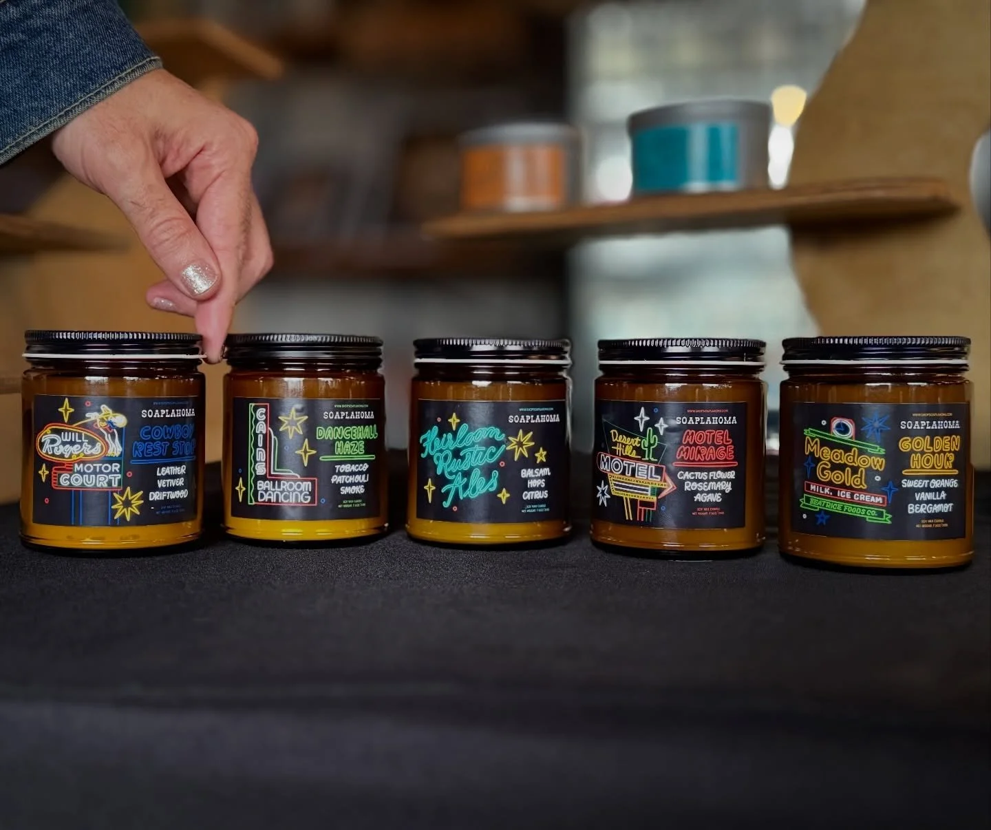 Adri always making sure everything is perfectly spaced out👇🏼😌 snag one of our new neon sign candles at @meadowgoldmack today!