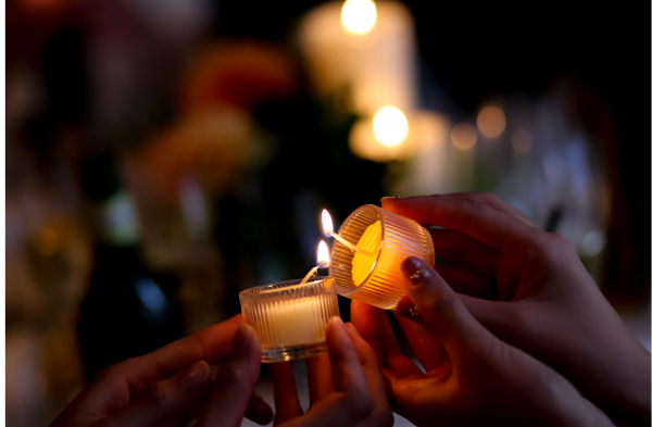Lighting one candle with another to light the way together.