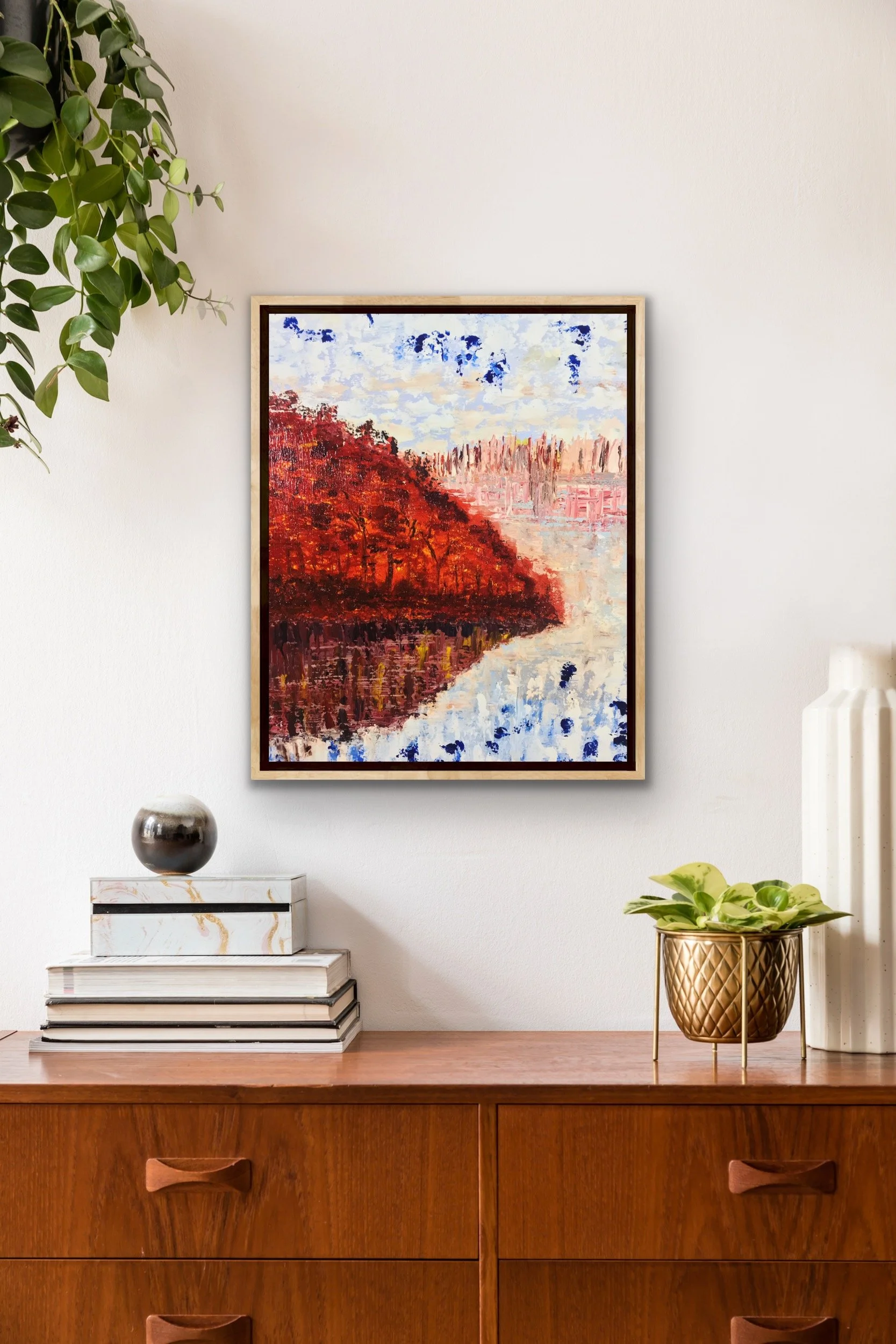 Abstract painting of a forest settlement under a vivid autumn sunset, with warm gold and amber tones