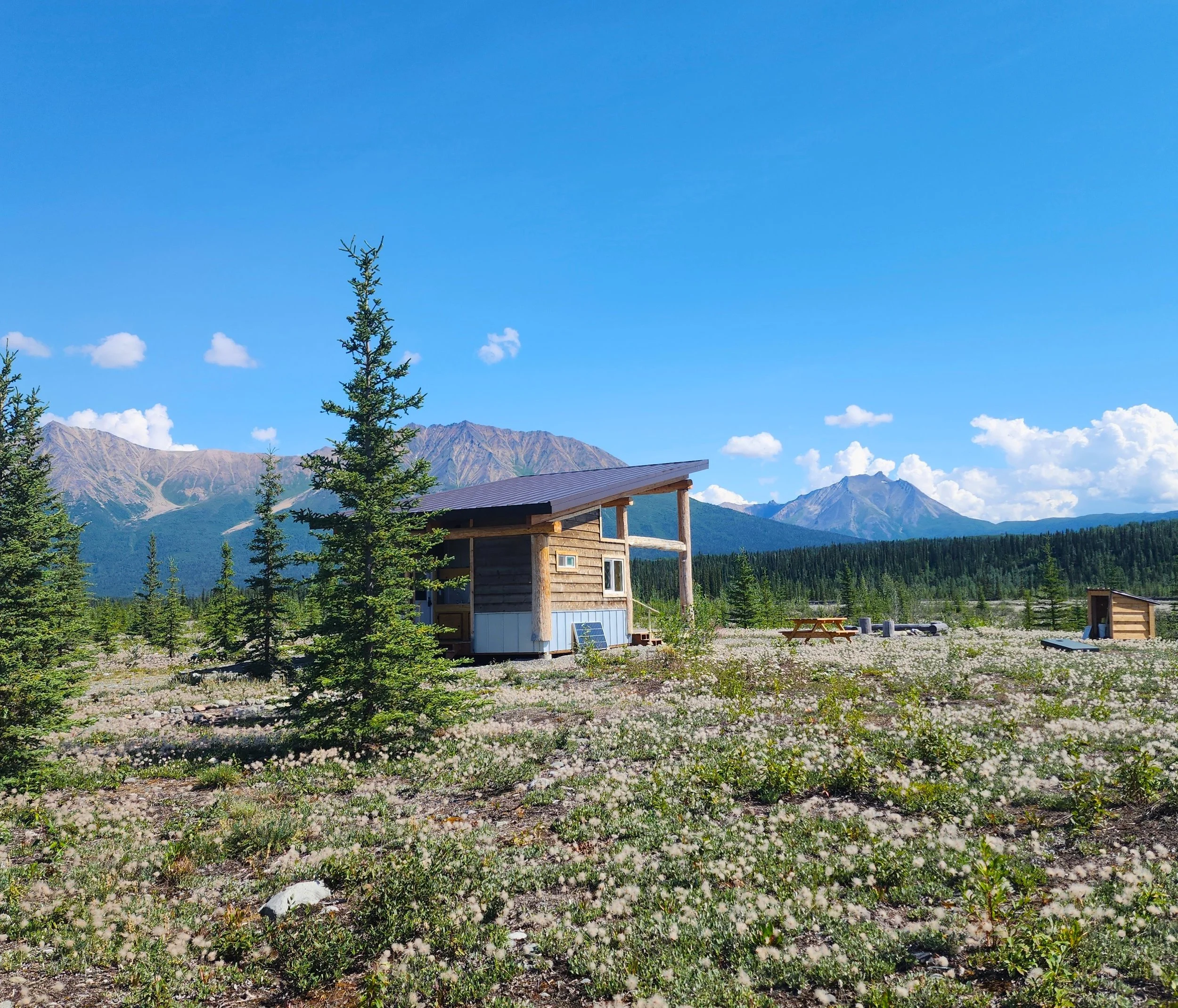 The Pavilion at Camp McCarthy with campfire ring and epic views