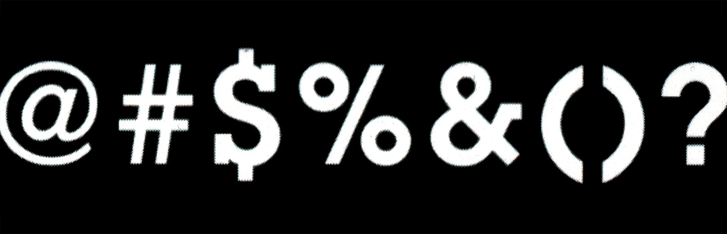 White alphanumeric and symbol characters on a black background, including @, #, $, %, ^, &, *, (, ), _, +, -
