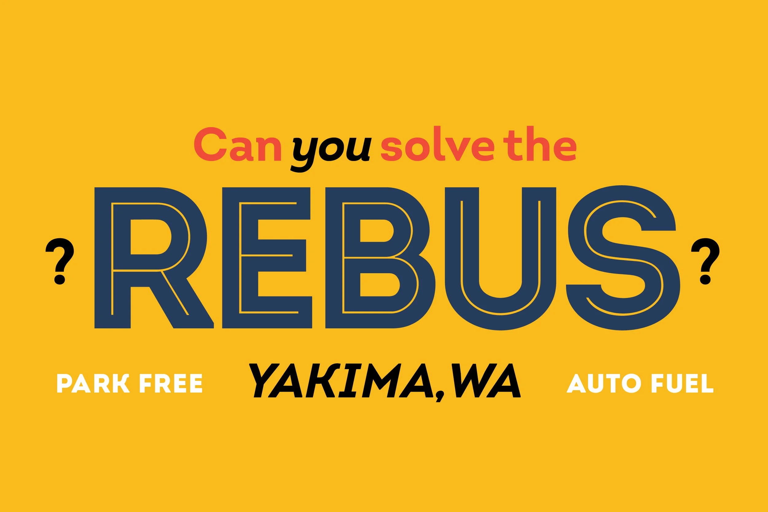 Colorful sign reading 'Can you solve the REBUS?' with clues 'PARK FREE' on the left, 'AUTO FUEL' on the right, and the location 'YAKIMA, WA' in the center.