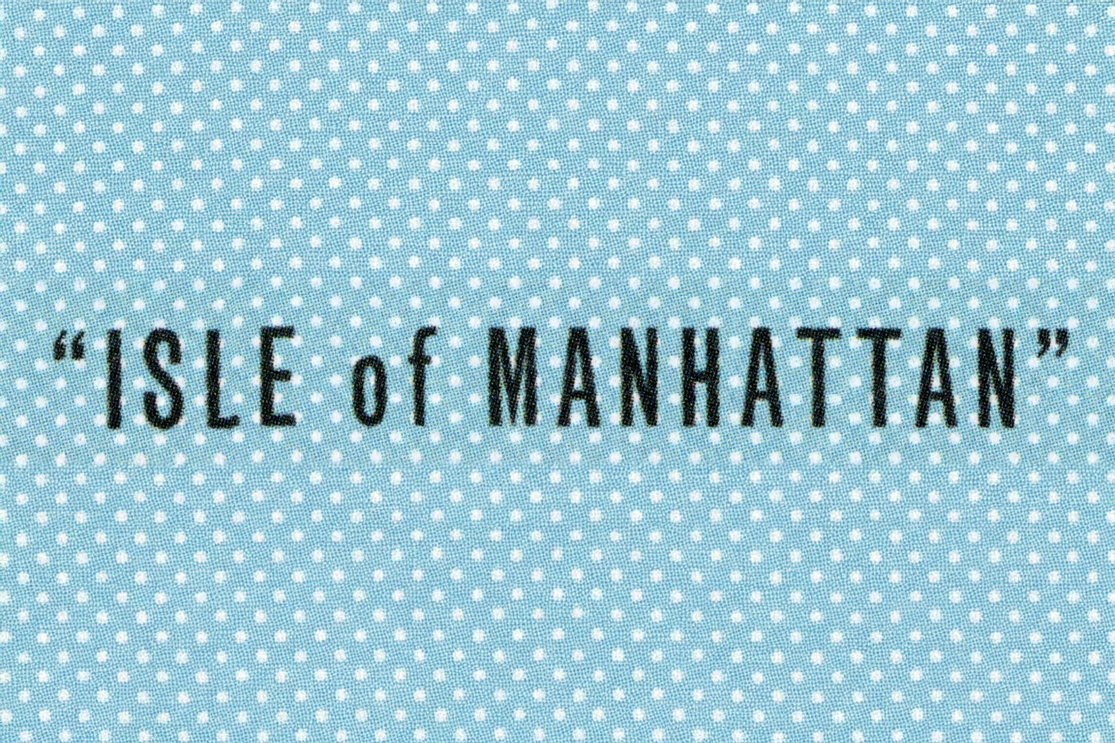 A blue background with white polka dots and the words "I SLEf MANHATTAN" in black text.