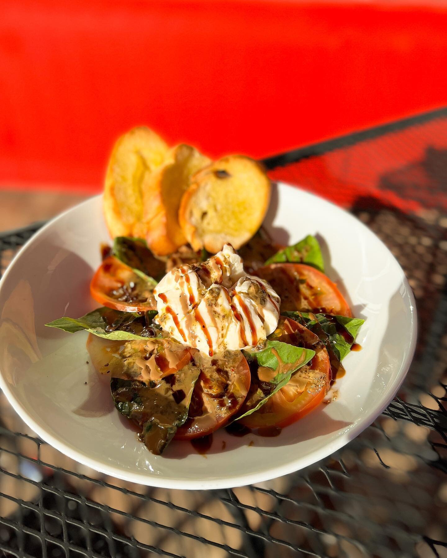 Start your meal at The Pizzeria with our Burrata Mozzarella Caprese with Fresh Mozzarella, Sliced Tomatoes, Fresh Basil Leaves, Topped with Opal Basil Honey Dressing &amp; Balsamic Reduction served with crostini bread 🍅🌿