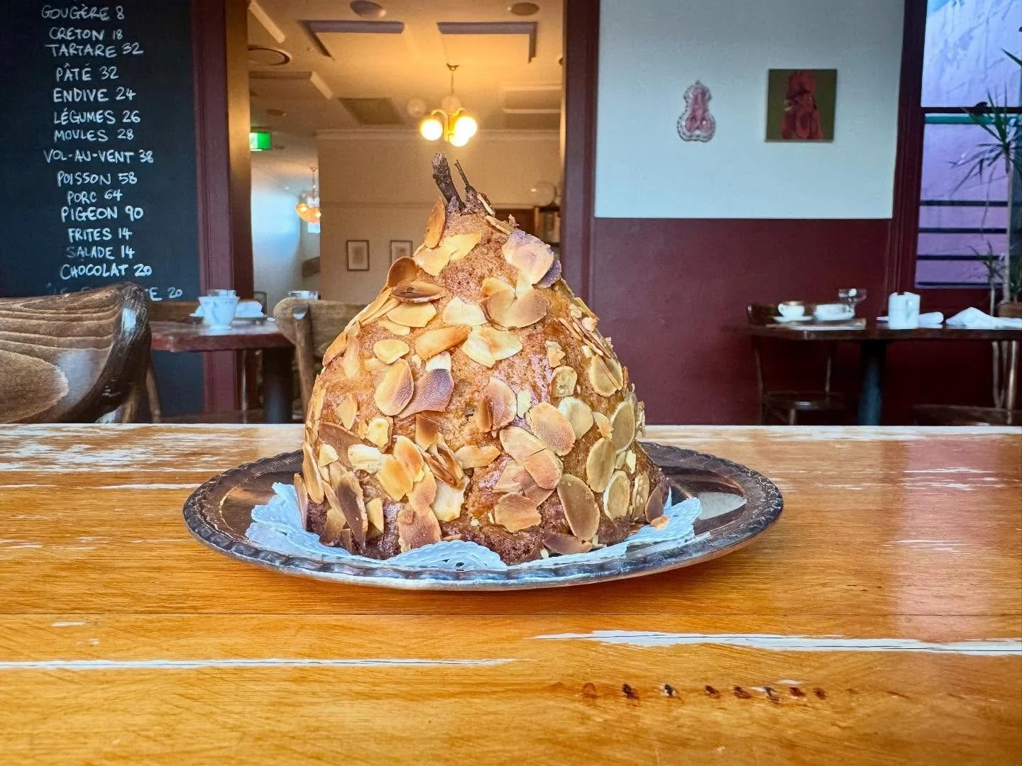 &ldquo;Poire Almondine&rdquo; 
Ripe Pears filled with Almond Cr&egrave;me P&acirc;tissi&egrave;re, wrapped in Almond Sabl&eacute;e and baked in the oven. Served warm with Hot Chocolate Sauce &amp; Vanilla Ice Cream.

#enterthroughthegiftshop