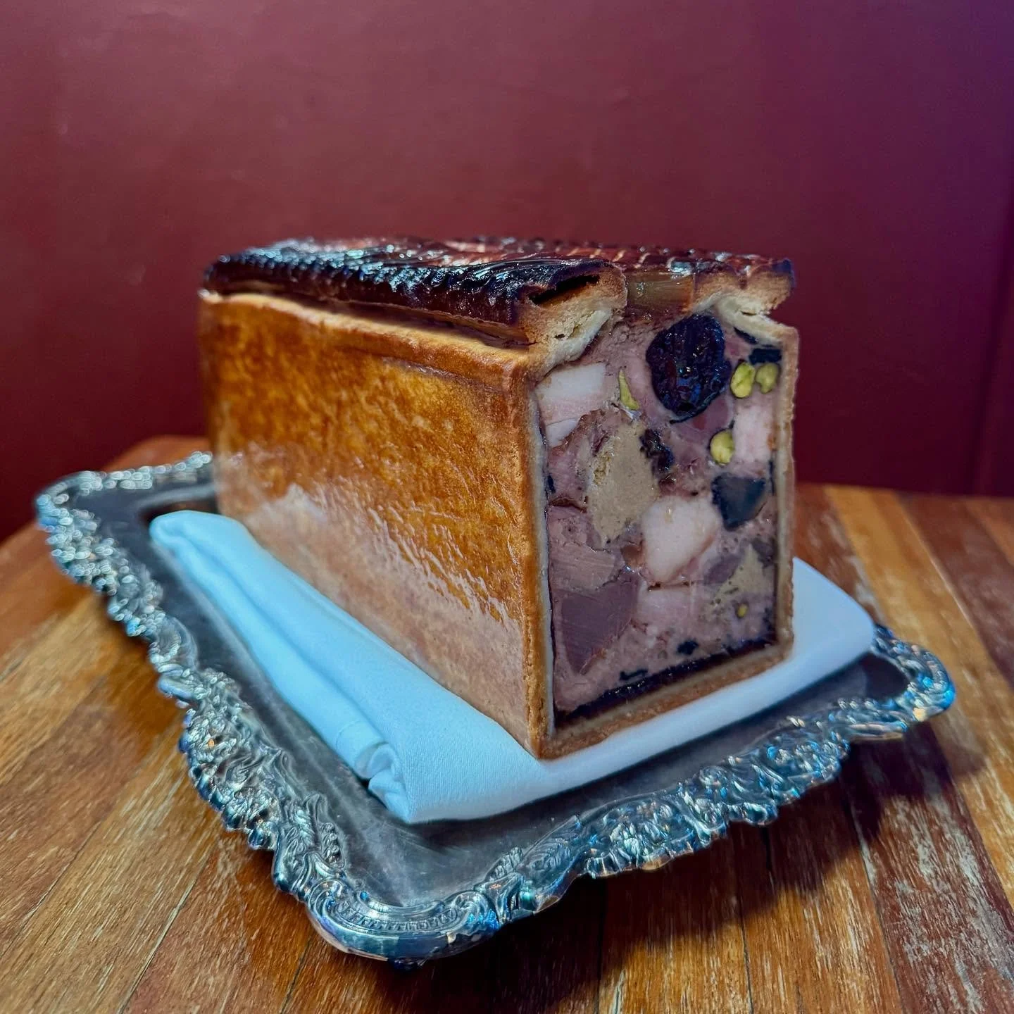 &ldquo;P&acirc;t&eacute; en Cro&ucirc;t&eacute; Gourmande&rdquo;

Featuring lots of our favourite things including Confit Duck Legs &amp; Gizzards, Foie Gras, Belly Ham, Wild Mushrooms, Prunes, Pistachios, Preserved Truffles &amp; Armagnac. 
All capp