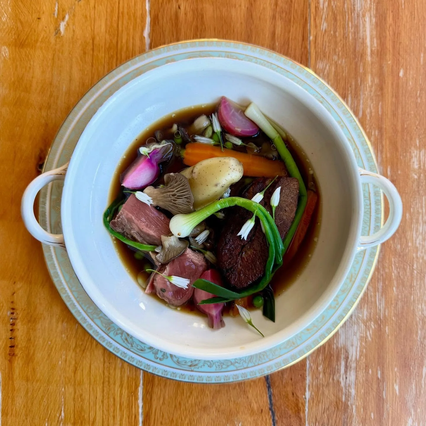 Rose Veal &ldquo;Pot Au Feu&rdquo; 

Braised and Pressed Brisket with a slice of Roasted Fillet in a Veal &amp; Sherry Consomm&eacute;. Served with lots of Spring Vegetables, Toasted Cepe Oil &amp; Garlic Flowers.

#enterthroughthegiftshop