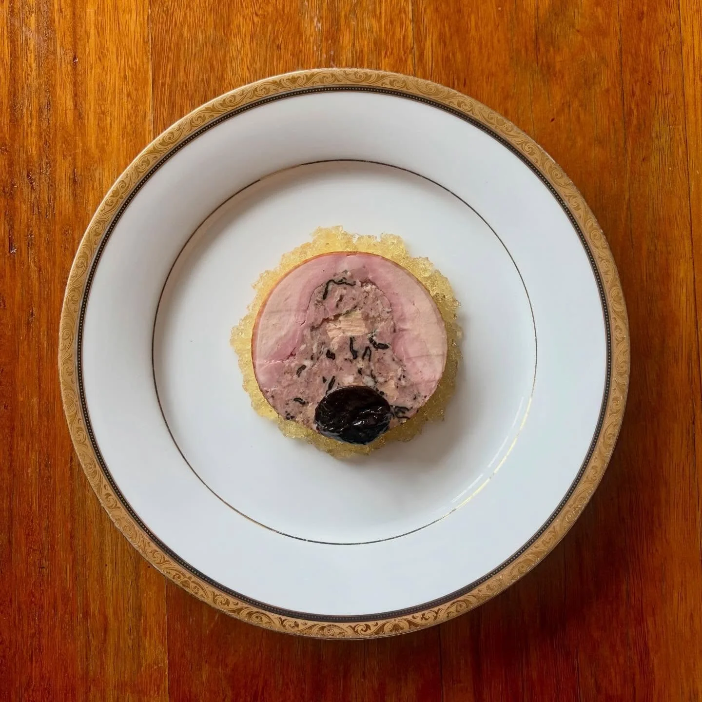 &ldquo;Galantine de Canard&rdquo;
A Whole Duck marinated in Madeira and rolled with a farce of Pork, Foie Gras, Trompette Mushrooms and Preserved Black Truffles. Poached and served cold by the slice with chopped Madeira jelly and Marinated Prunes. 

