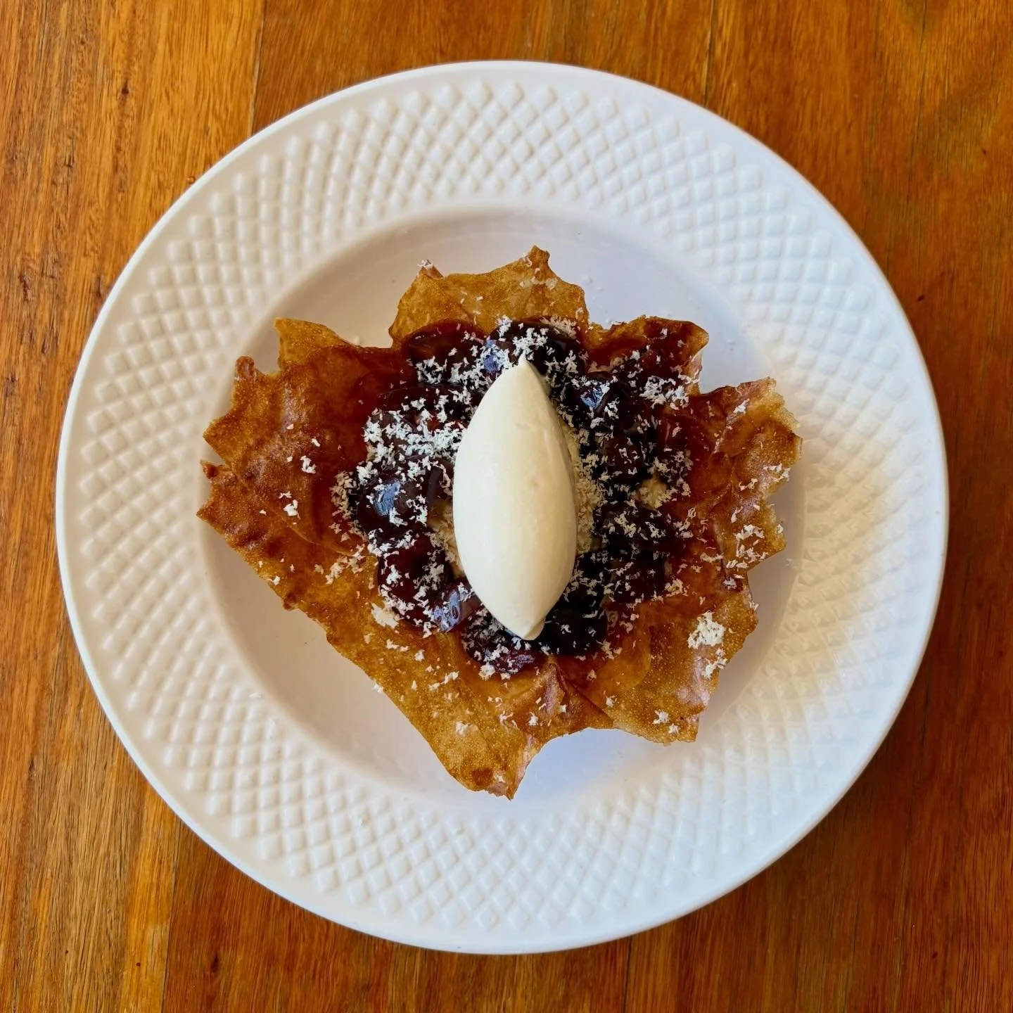 A Crispy &ldquo;Tartelette&rdquo; of Brik Pastry &amp; Brown Sugar with Coconut Jam, Coconut Custard and Cherrys preserved in Armagnac. finished with a rocher of Kirsch Ice Cteam.

Because dessert deserves a drink.

#enterthroughthegiftshop