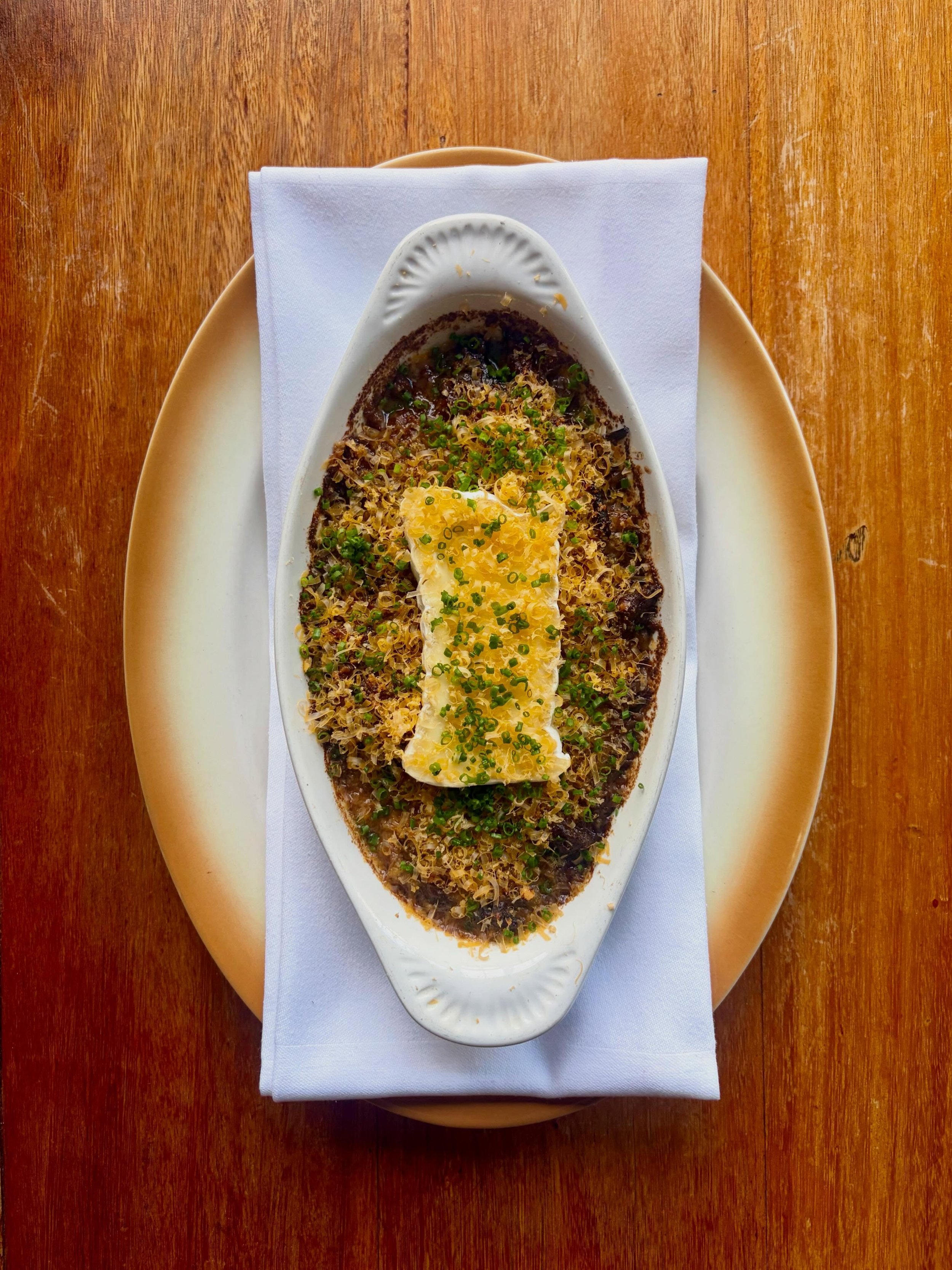 &ldquo;Gratin de Champignons&rdquo; D&rsquo;Affinois &amp; Mimolette.

A soul warming dish of chestnut mushrooms and shallots cooked in savagnin wine, cream and garlic. Served with a crust of breadcrumbs &amp; thyme , a slab of triple cream Daffinois