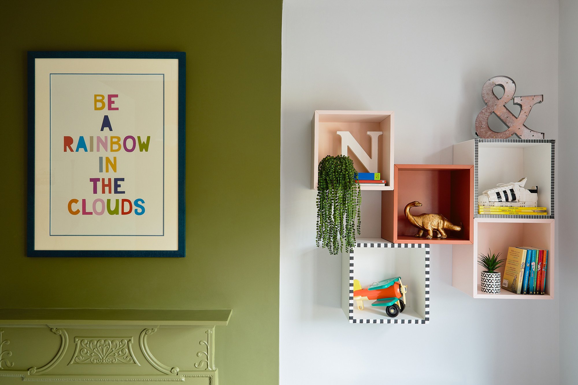 framed-poster-on-green-wall-next-to-storage-cube-shelving.jpg
