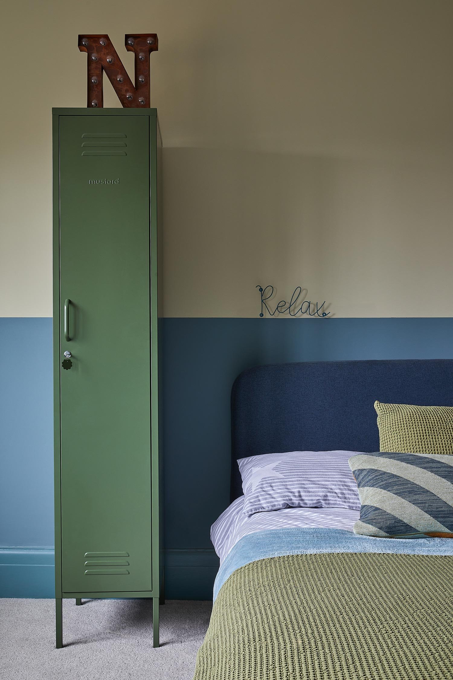 locker-room-style-green-cabinet-next-to-bed.jpg