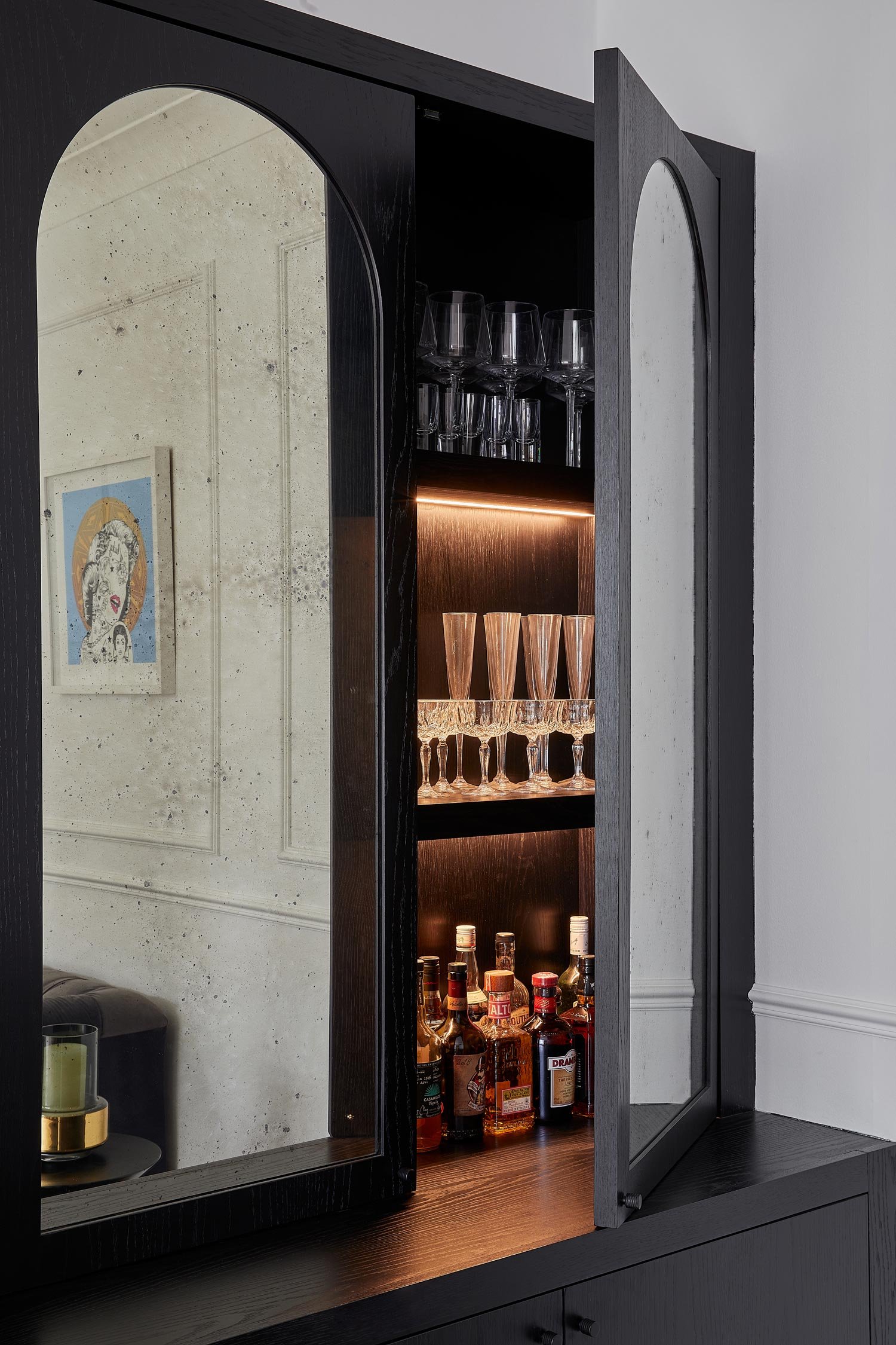 open-door-of-mirrorred-drinks-cabinet.jpg