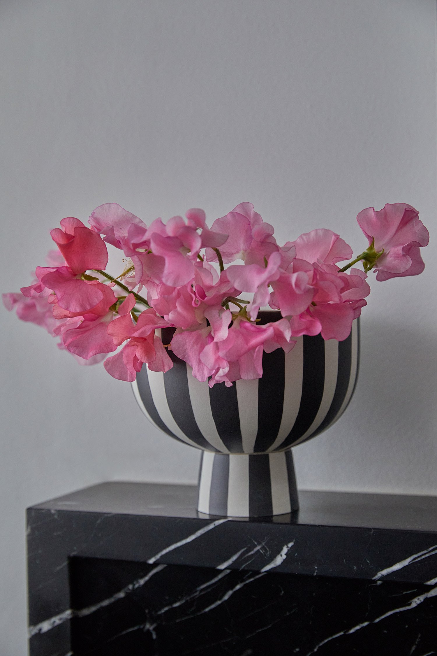 pink-flowers-in-striped-black-and-white-vase.jpg