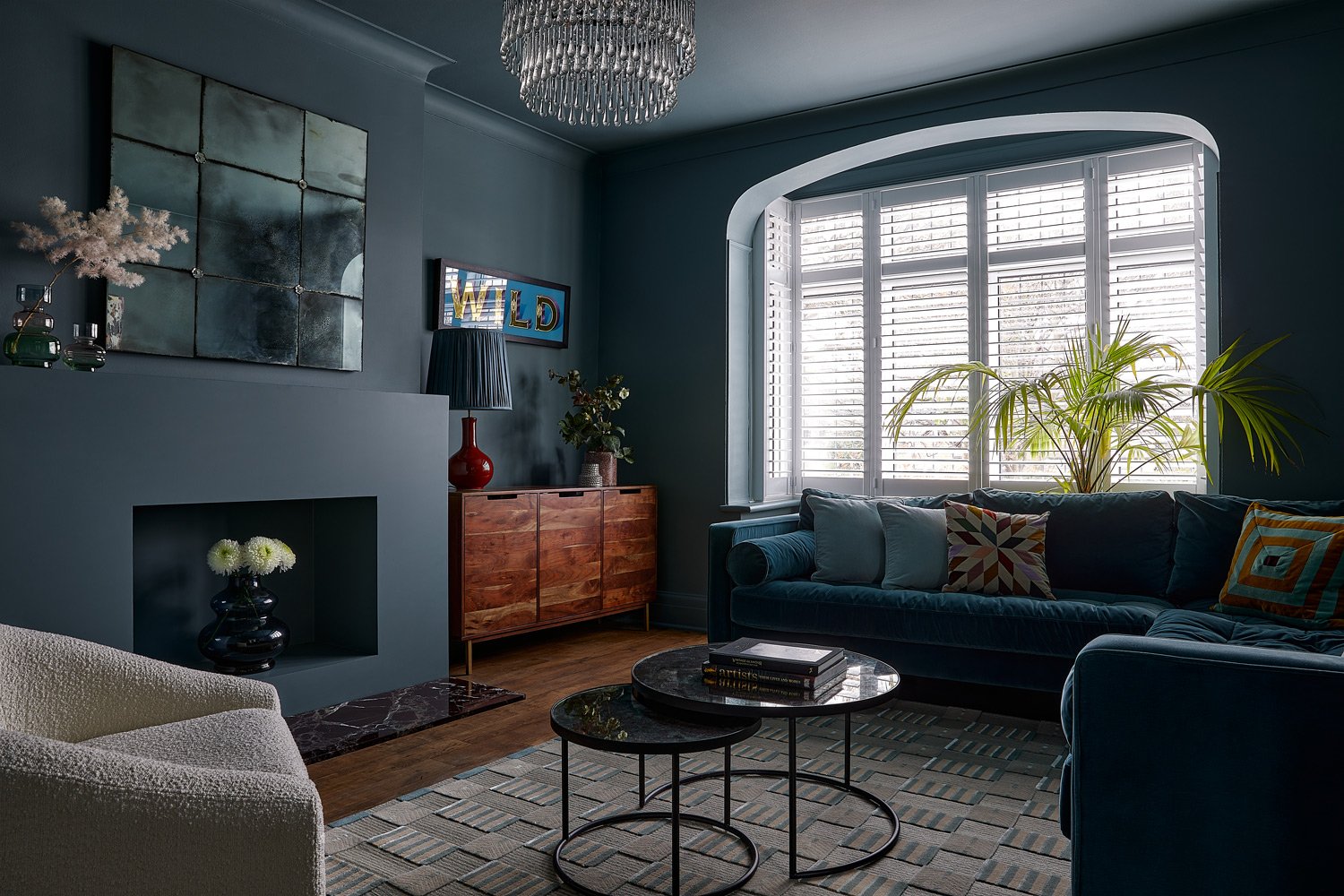 slate-grey-lounge-walls-withteal-sofa-infront-of-large-window.jpg