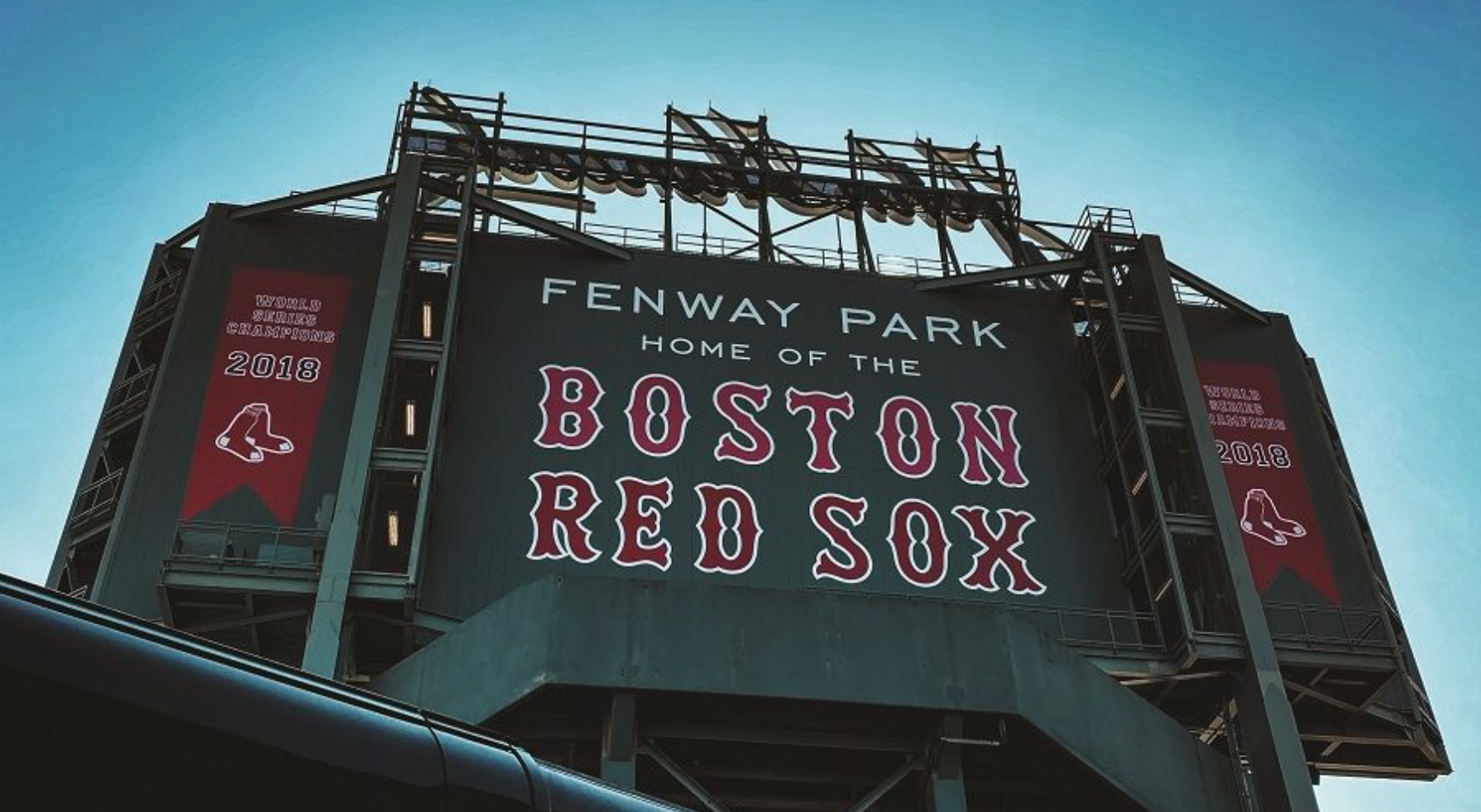 A picture of the Fenway Park sign that reads, "Fenway Park, Home of the Boston Red Sox"
