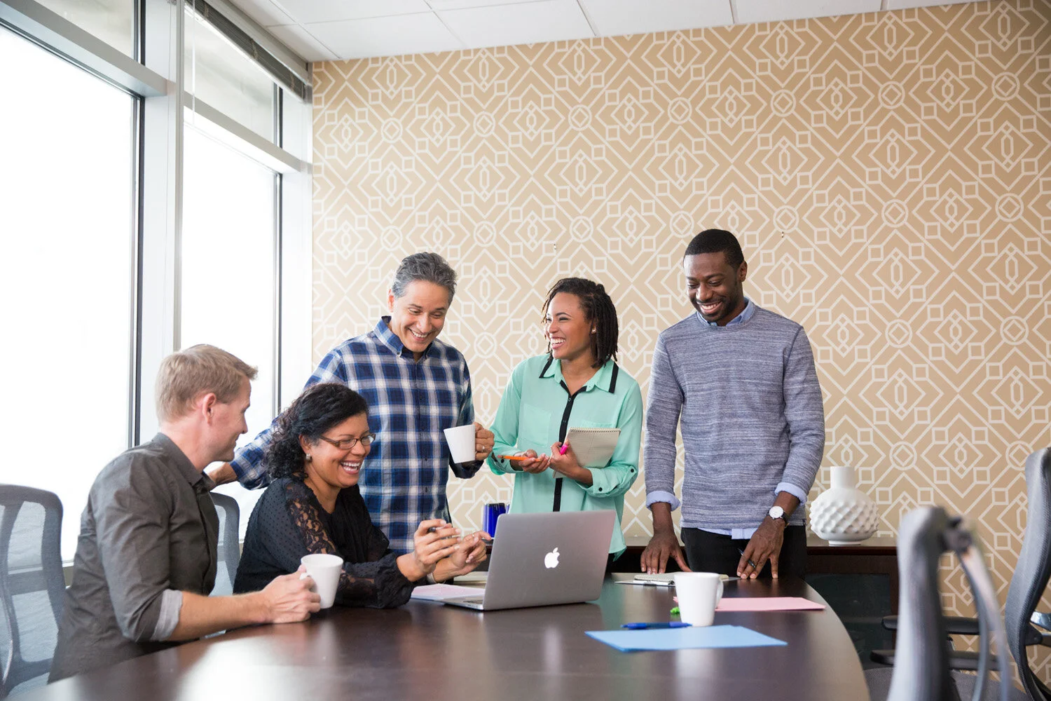 a Photograph of team meeting in conference room