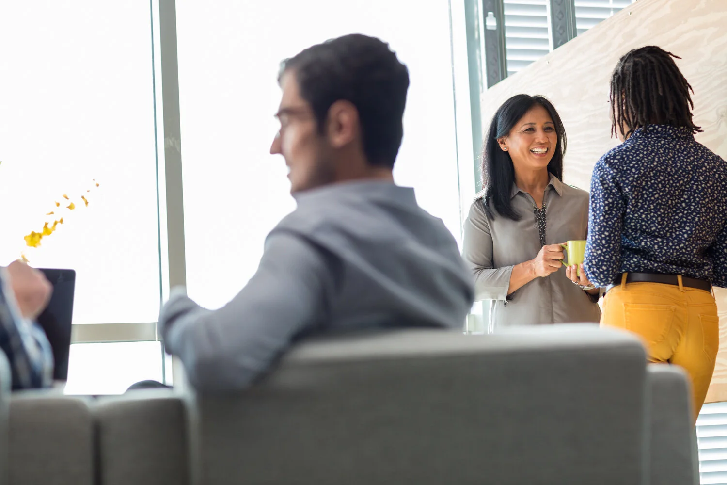 Photograph of people in company lounge