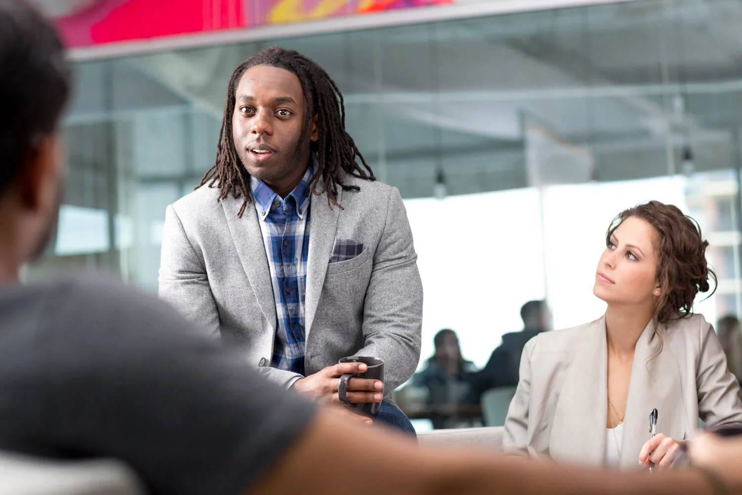 Photograph of people having meeting at company
