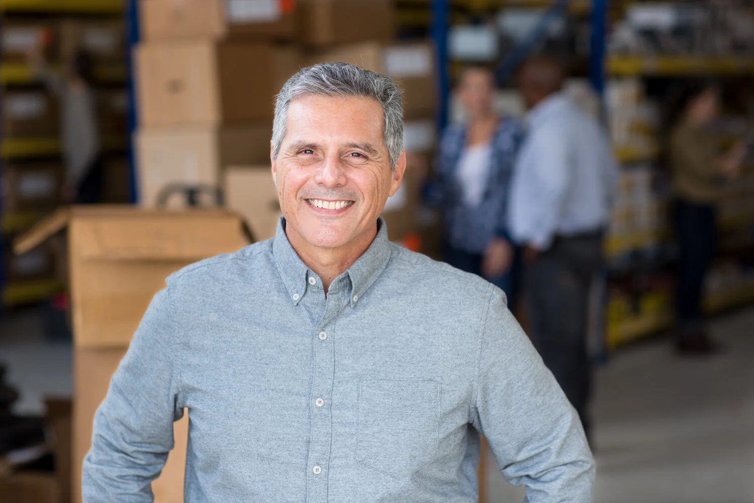 Photograph of latino boss in warehouse