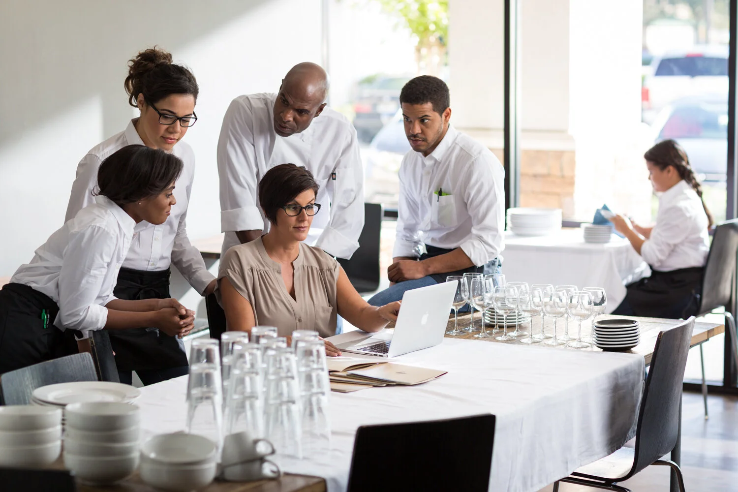 Photograph of team meeting in restaurant