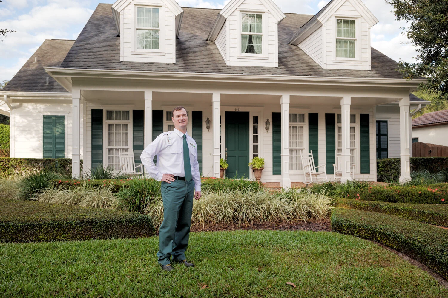portrait of Massey Services technician in front of house