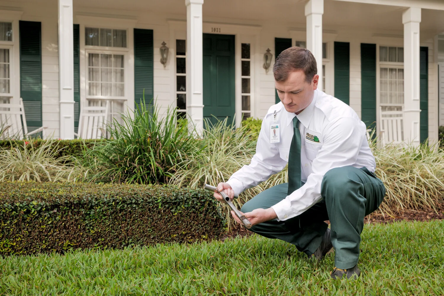 Massey Services technician inspecting yard