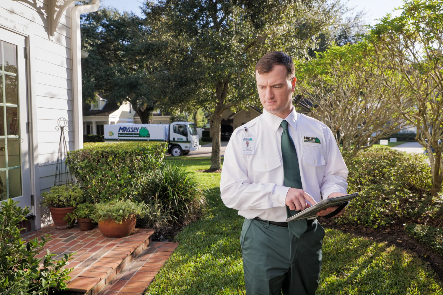 Massey Services technician inspecting side of house in central florida