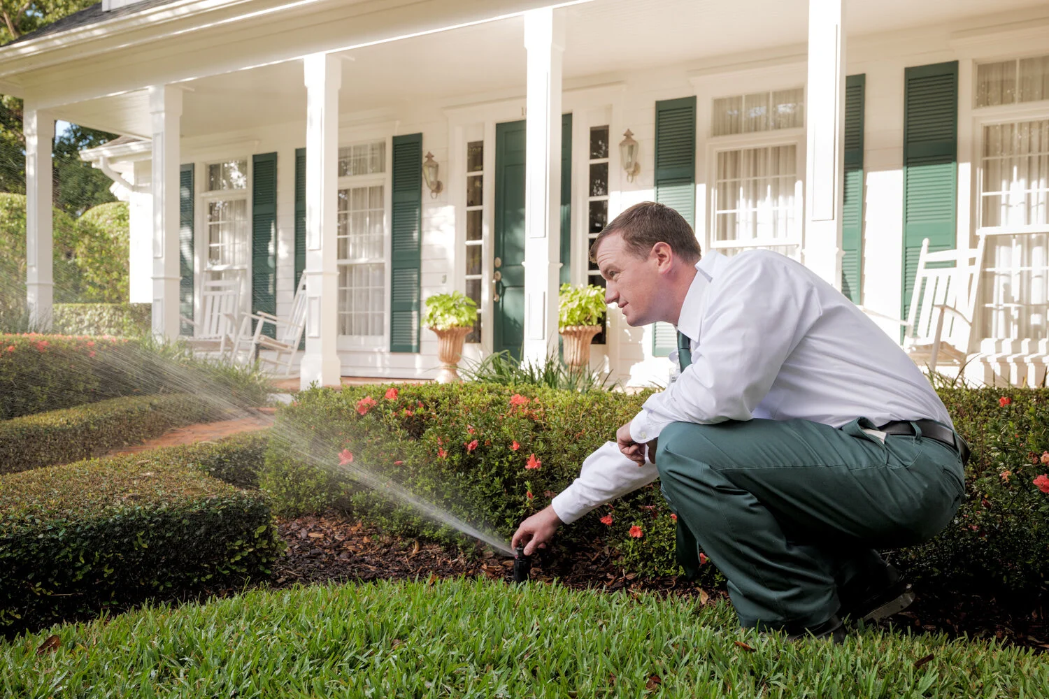 Massey Services adjusting sprinklers in home in central florida
