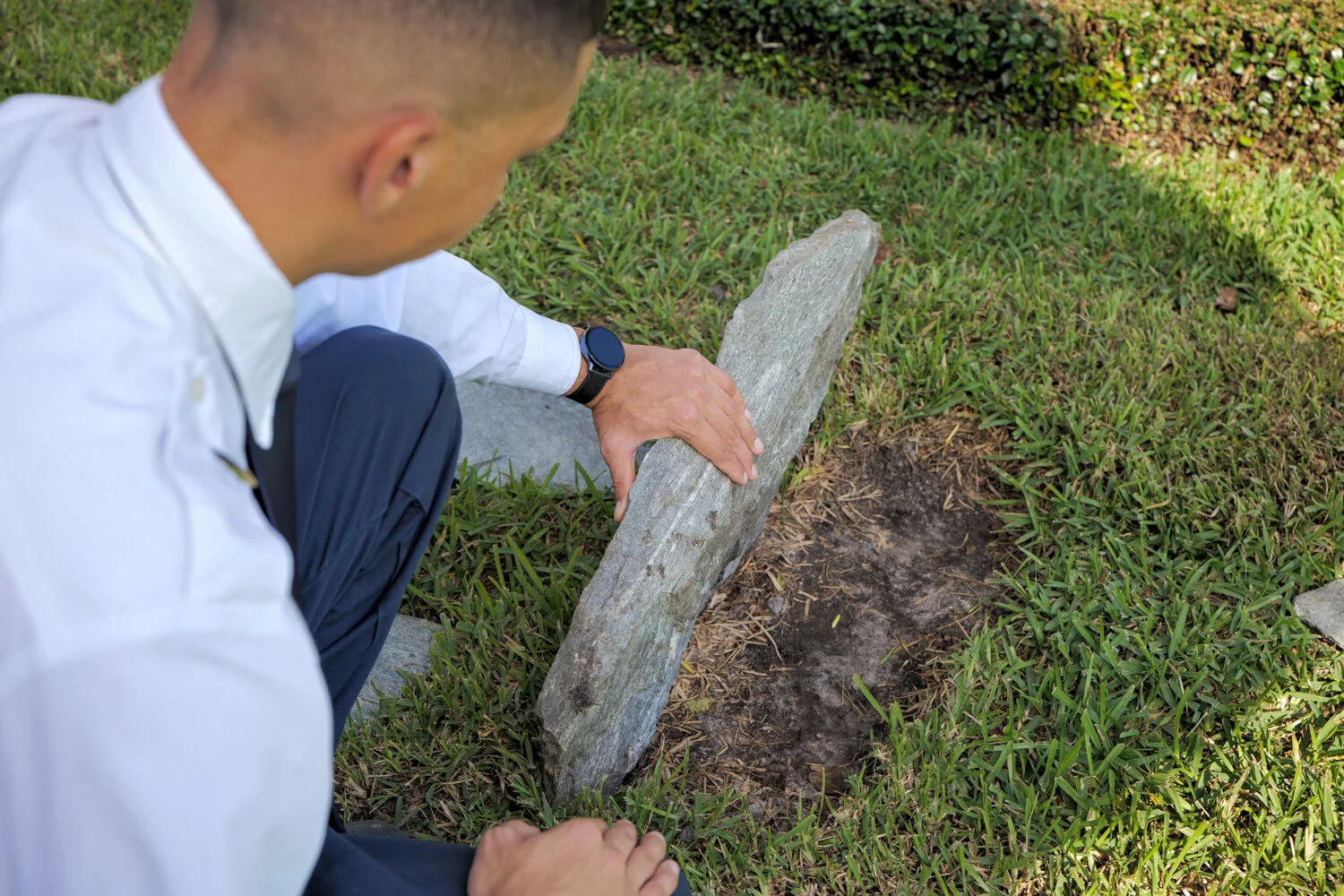 Massey Services inspecting under rock at home in orlando