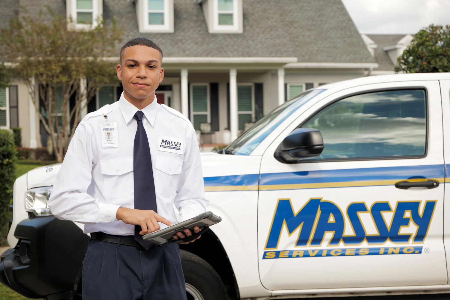 Massey Services in front of truck in neighborhood
