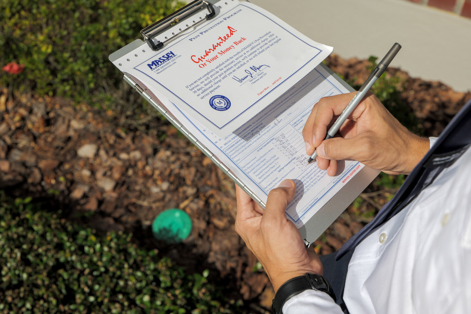 Massey Services taking notes about a home