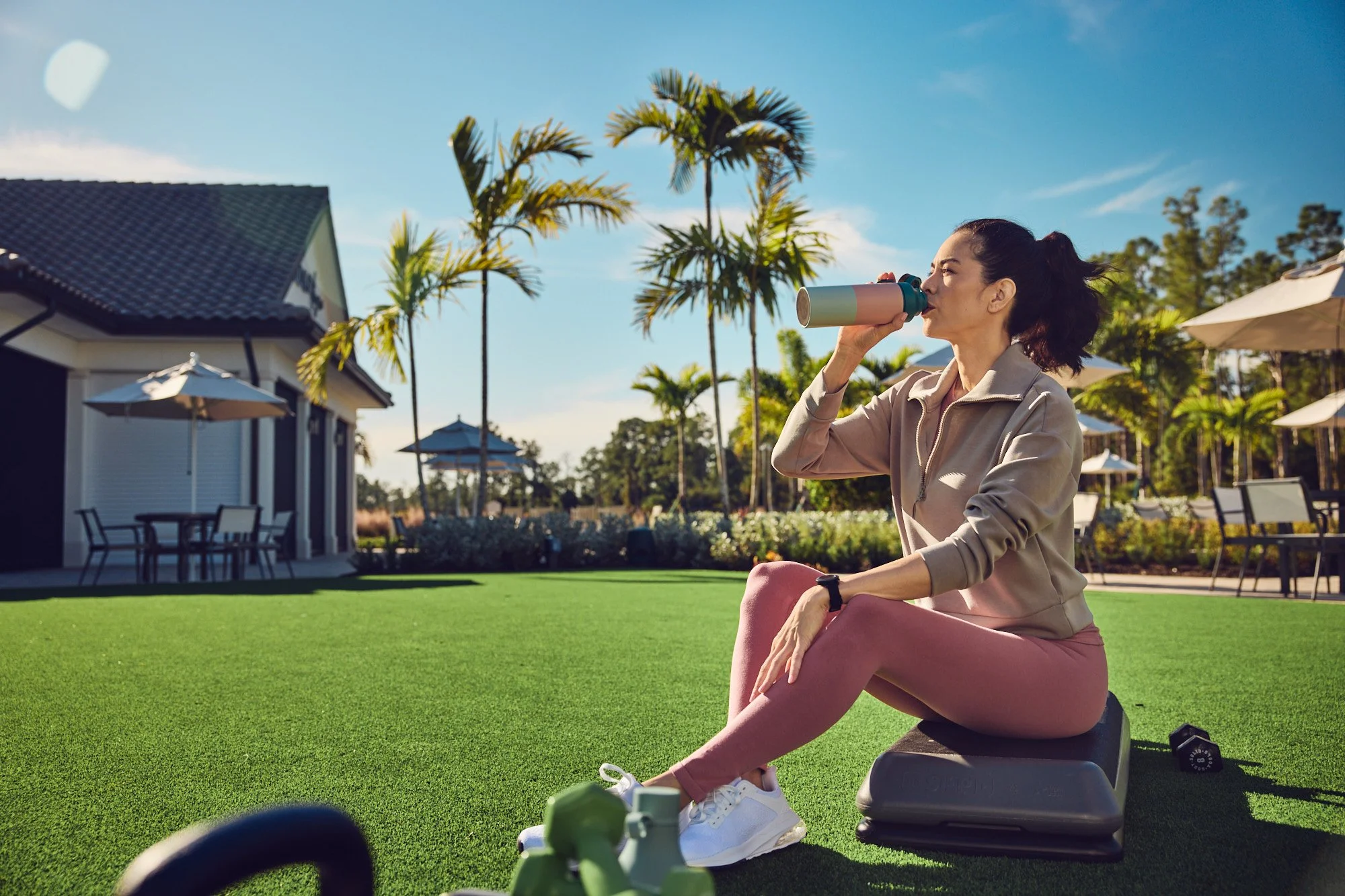 Lifestyle photo - woman drinking after outdoor workout - Del Webb campaign Tampa FL
