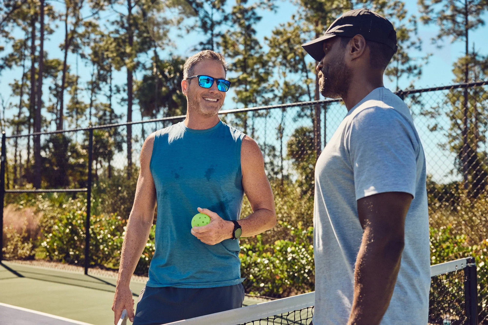 Lifestyle photo - Men talking over pickleball - Del Webb campaign Tampa FL