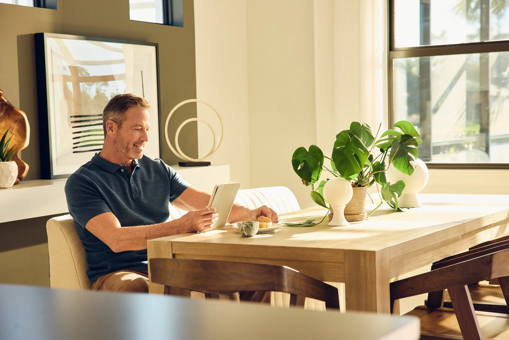 Lifestyle photo - Man at dining table sunrise - Del Webb campaign Tampa FL