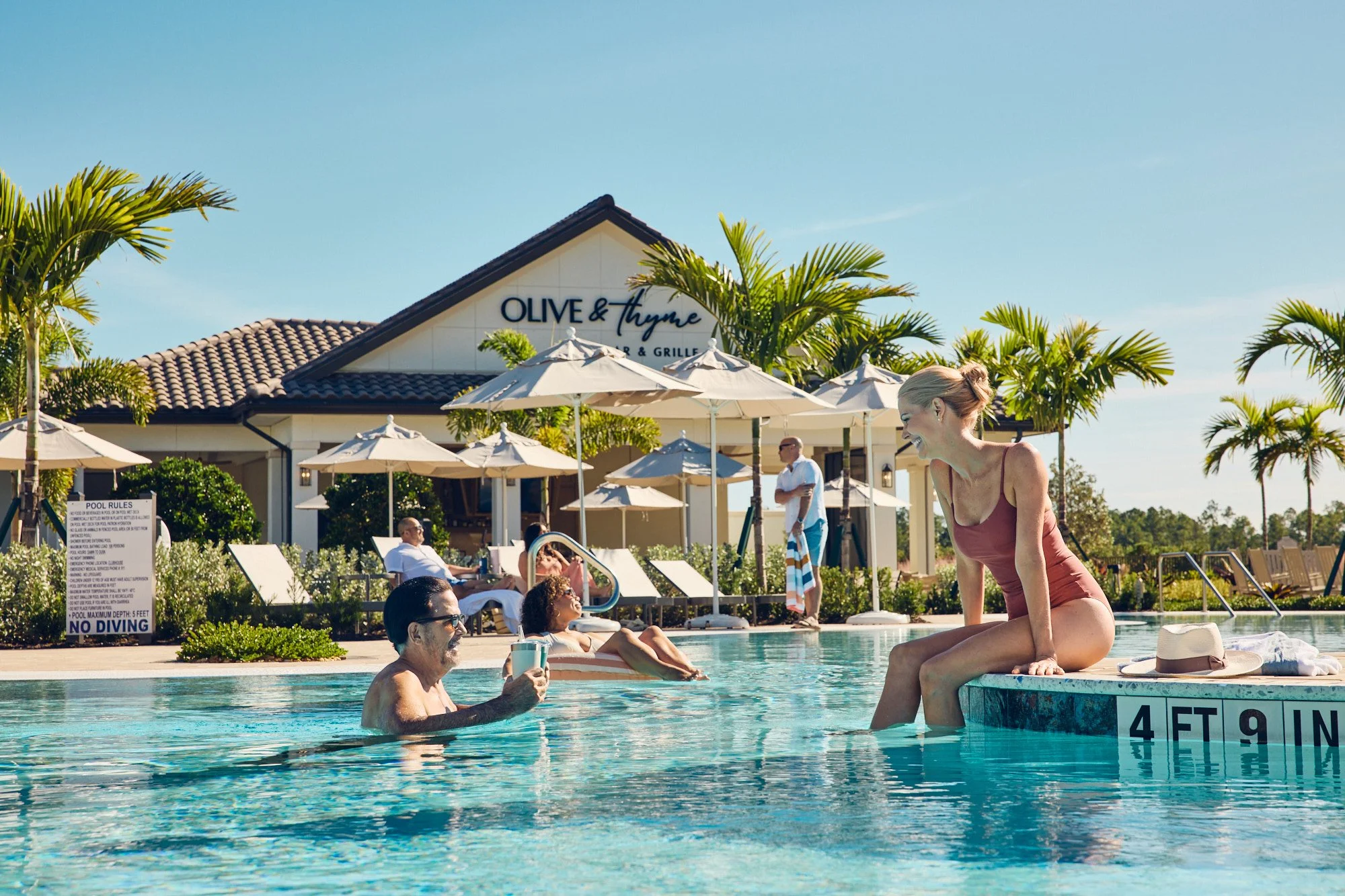 Lifestyle photo - people enjoying community pool - Del Webb campaign Tampa FL
