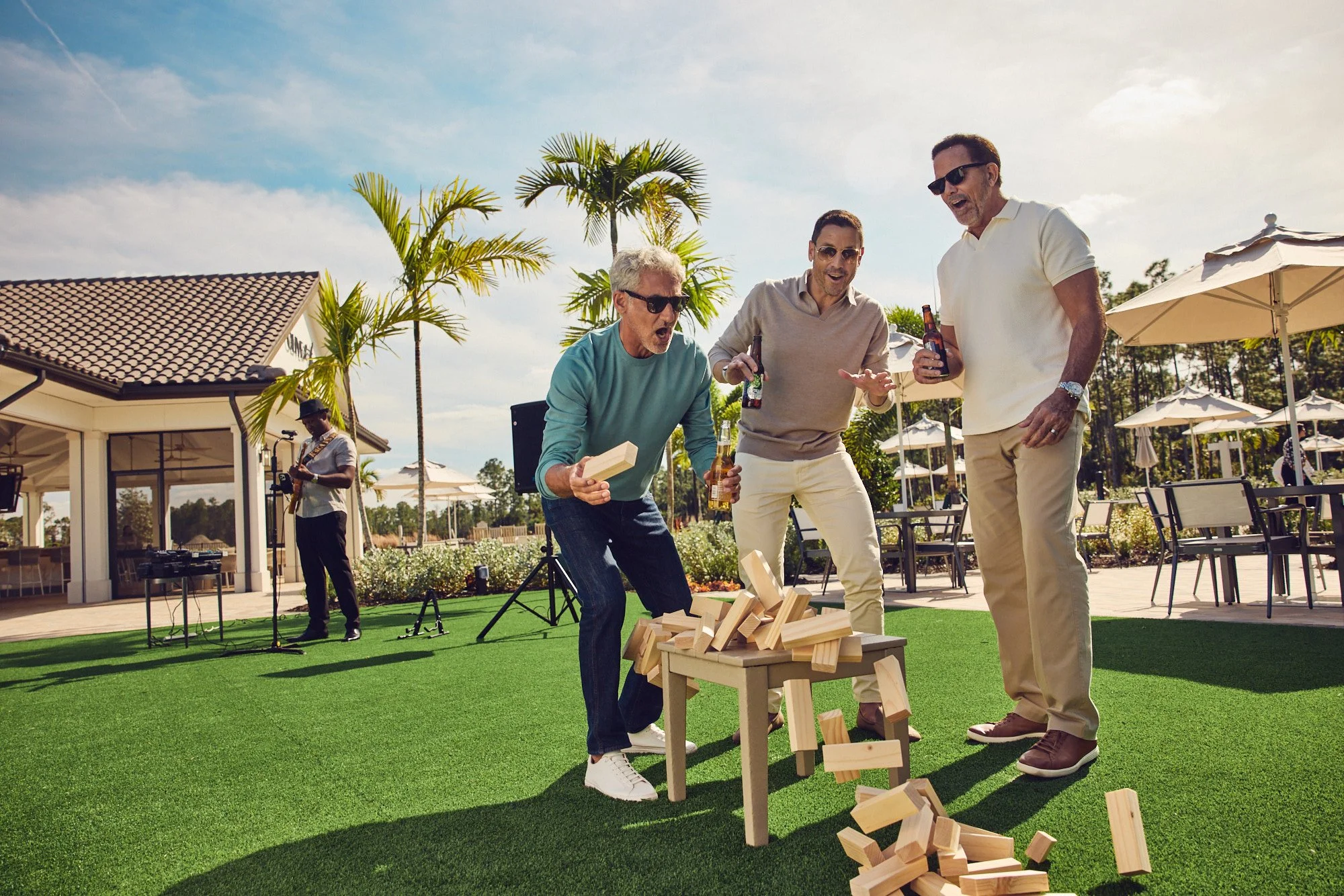 Lifestyle photo - men playing yard jenga - Del Webb campaign Tampa FL