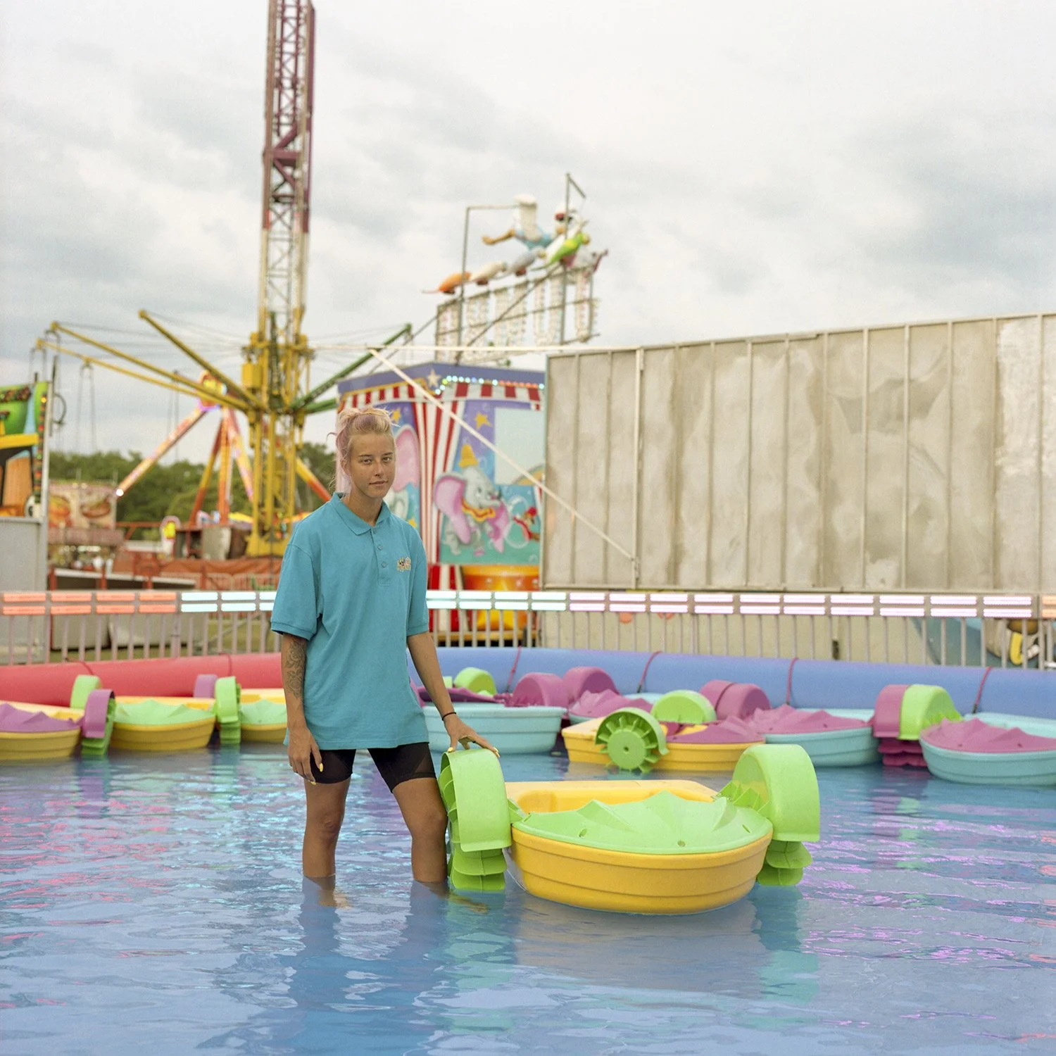 photograph of carnival worker in water
