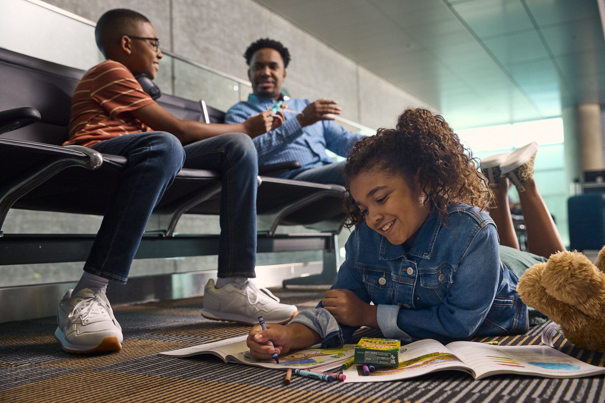 girl coloring on floor at tampa international airport