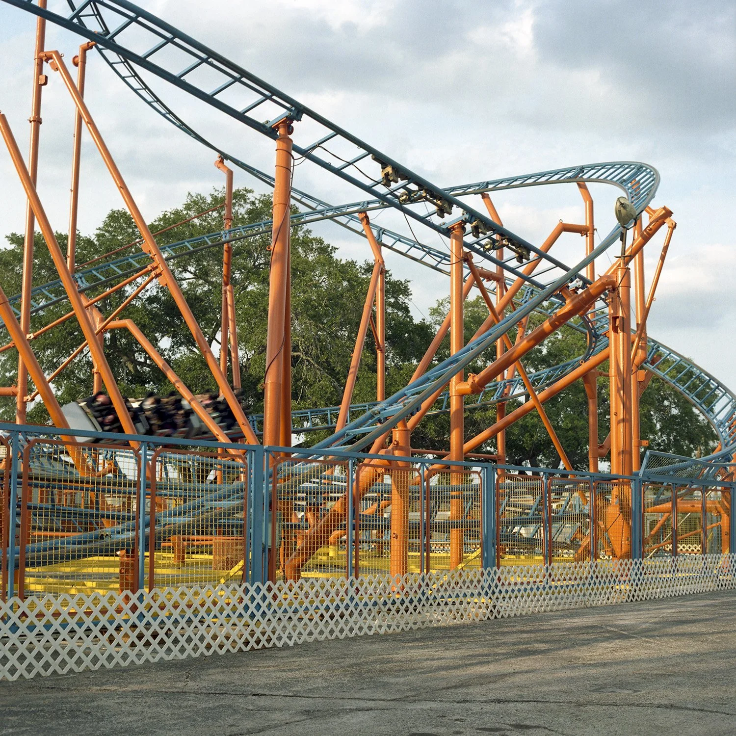 photograph of roller coaster at carnival