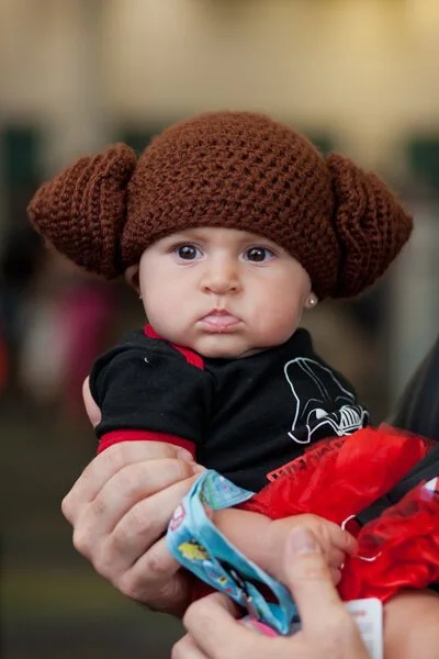 photograph of baby dressed as princess leia at star wars celebration