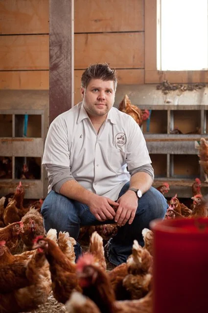 photograph of chef tony adams with chickens